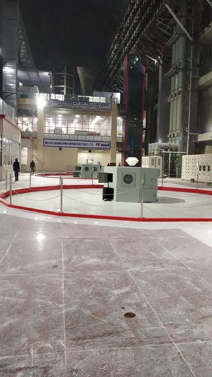 Pump house floor at the Kaleshwaram project with stainless steel chain railing around a pump unit